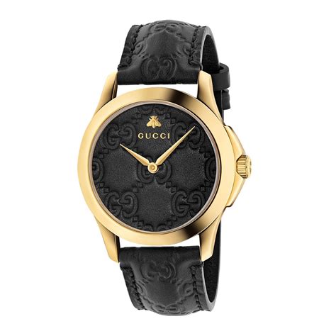 black and gold Gucci watch